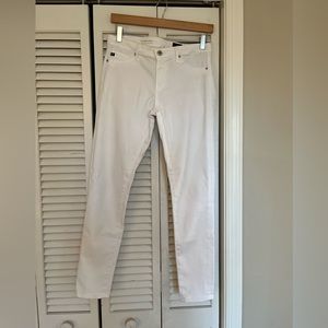 Anthropology size 28(fits a size 4). White. Mid rise super skinny.